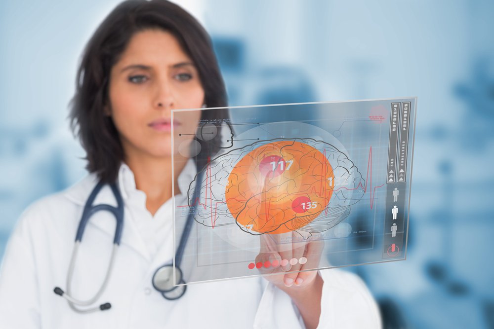 Female doctor touching a touchscreen in the hospital